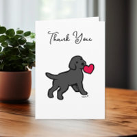 Labrador negro con tarjeta de agradecimiento