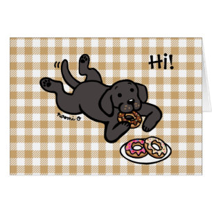 Labrador negro y buñuelos que piensan en usted