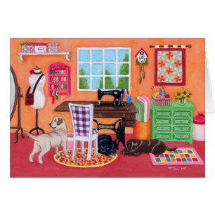 Labradors en el sitio de la costura de la mamá