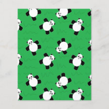 Oso panda tendido sobre la hierba