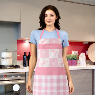 Lazos rosados lindos y delantal elegante con graci