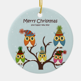 Lechuzas navideñas moras en el ornamento del árbol