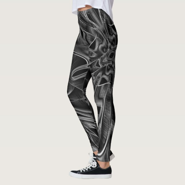 Leggings Bastante adornado con ranuras grises, fondo negro (Izquierda)