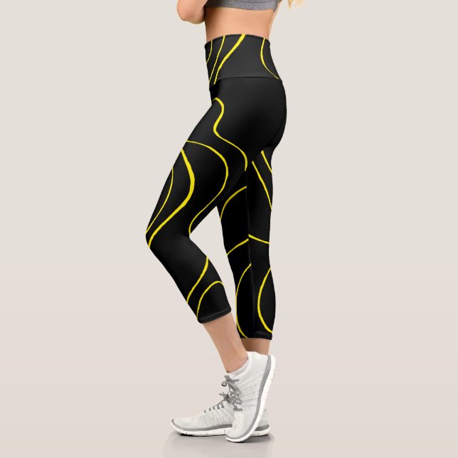 Leggings Capri Ebb and Flow 2 en negro y amarillo (Izquierda)