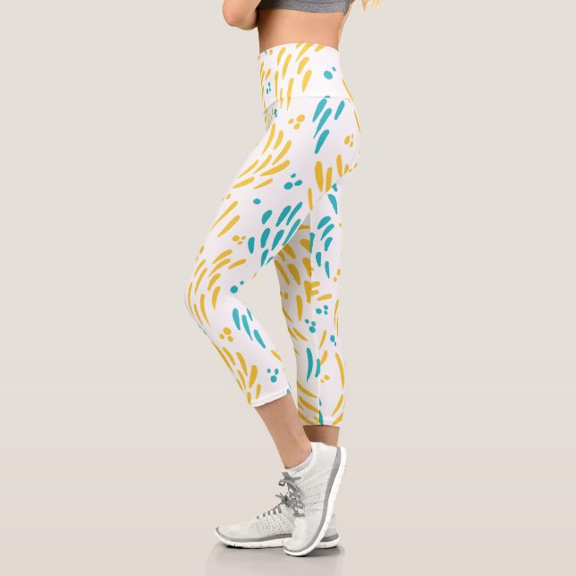 Leggings Capri Flujo en azul turquesa y amarillo (Izquierda)