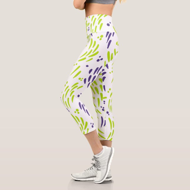 Leggings Capri Flujo en verde limón y púrpura (Izquierda)