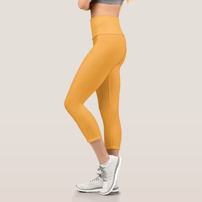 Leggings Capri fondo amarillo con borde negro (Izquierda)