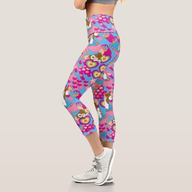 Leggings Capri Gizmo | Patrón rosa de paz y amor (Izquierda)