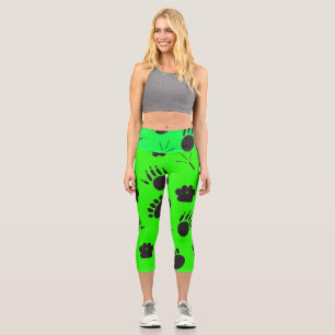 Leggings Capri Huella de animales y aves, fondo verde