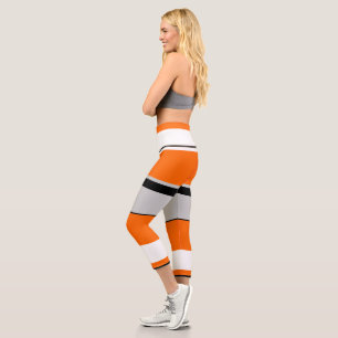 Leggings Capri Naranja vibrante, blanco, negro y rayado de ceniza