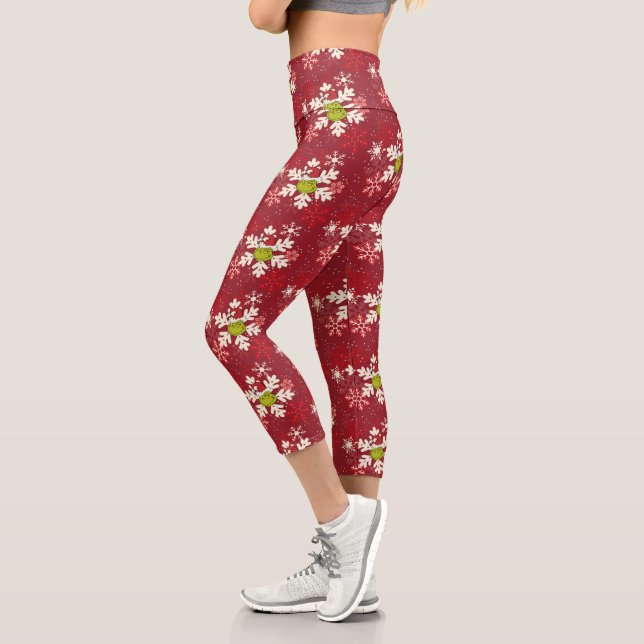 Leggings Capri Patrón de copo de nieve rojo Grinch (Izquierda)