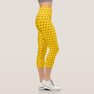 Leggings Capri Siluetas de pequeñas bananas negras sobre amarillo