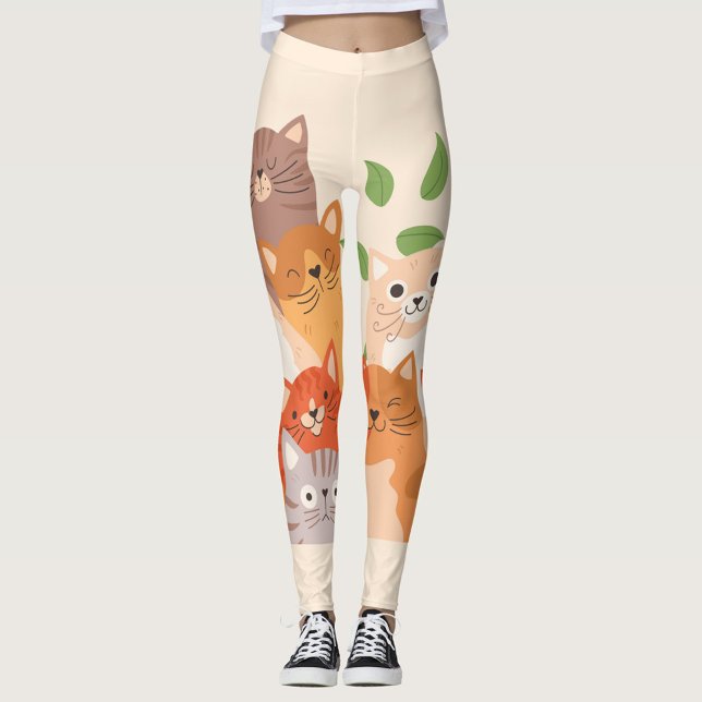 Leggings Flip Flops de gatos personalizados (A woman is wearing leggings with a pattern of cartoon cats and green leaves.)