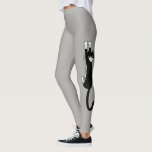 Leggings Gato negro y blanco colgando | Gracioso gato de Tu<br><div class="desc">Gato negro y blanco sujetándose con garras grises grises. Diversión para el gimnasio, clases de yoga o en casa en el sofá curvados con tu gatito. Echa un vistazo a Jenn's Doodle World para ver aún más insólitas leggings y productos de diversión con este loco gato de esmoquin. ©Jenn Inashvili...</div>