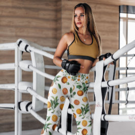 Leggings Naranjas con patrones de fruta blanca | Piernas