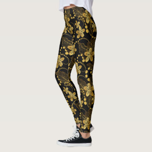 Leggings Negro y oro Patrón de flores y hojas tropicales
