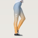 Leggings Nombre elegante en degradado azul claro a Naranja<br><div class="desc">El degradado azul claro a naranja presenta un nombre personalizado en una elegante fuente serif blanca que baja por el exterior de la pierna derecha. Personalízalo con tu nombre en la barra lateral y añade un toque moderno y colorido a tu armario. Para ver el diseño de la moda ombré...</div>
