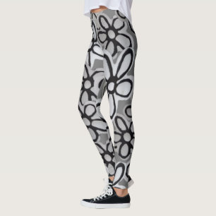 Leggings patrón de daisies en flor blanca y negra