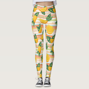 Leggings Patrón de esclavos naranjas con hojas verdes en Pa