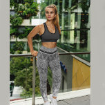 Leggings Patrón de estrella negra y gris<br><div class="desc">Echa un vistazo a esta hermosa leyenda hecha con un patrón estrella negro y gris. Tiene una opción personalizada. Este patrón es gradiente, tiene algunas líneas negras extra en la parte superior y un texto corto "¡Tu rocas!" en una pierna y un gráfico floral extra en el otro lado. Va...</div>