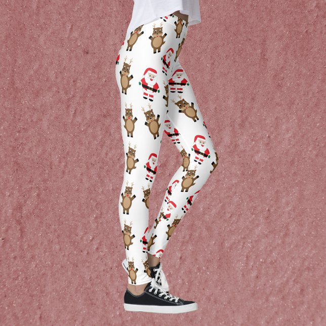 Leggings Patrón de Navidades de renos de Santa Claus Red Su (A pair of leggings featuring a pattern of Santa in a red suit and reindeer.)