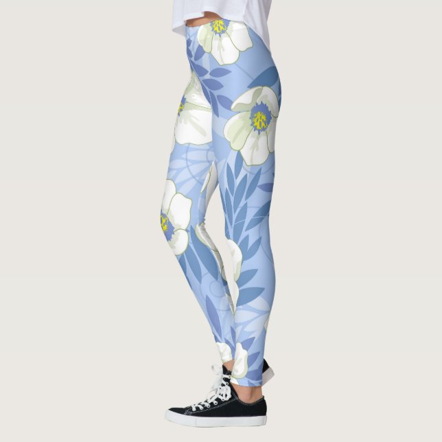 Leggings Patrón floral de flores blancas sobre fondo azul (Izquierda)