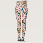 Leggings Patrón mariposa giratoria<br><div class="desc">Las legiones de patrón mariposa alegre y extravagante con un ilustracion de mariposas rosas,  amarillas y azules sobre un fondo rosado. También hay hojas verdes.</div>