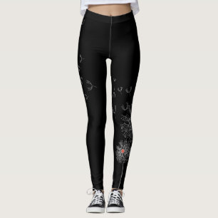 Leggings Piernas negras con papel de Dandelion en una piern