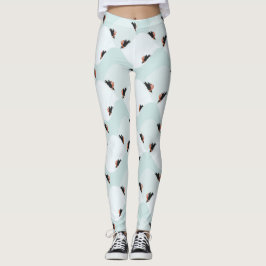 Leggings Pingüinos juguetones deslizándose sobre el patrón