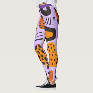 Leggings "Savanna Pop: Vibes tribales en Naranja y negro"