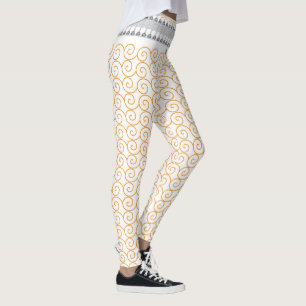 Leggings un fondo blanco y naranja con remolinos
