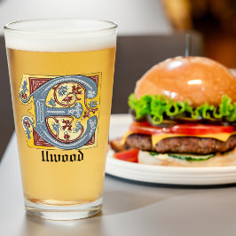 Letra medieval azul y marfil rojo iluminada E