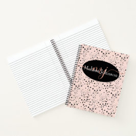 Letras doradas rosa elegantes en cuaderno negro