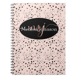 Letras doradas rosadas elegantes en cuaderno negro