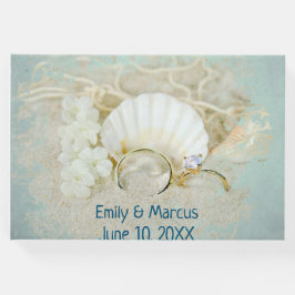 Libro De Visitas Anillos bodas y conchas marinas en arena
