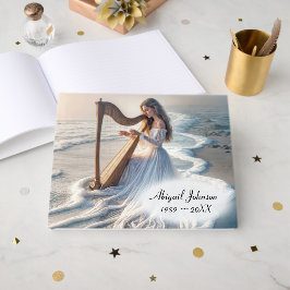 Libro De Visitas Mujer tocando el arpa en el oleaje del océano