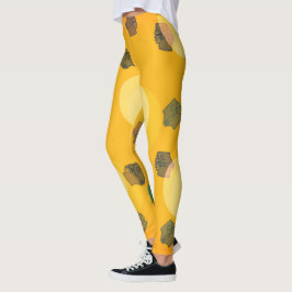 Libros voladores en leggings de oro