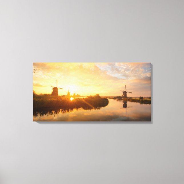 Lienzo Amanecer sobre molinos de viento y un río en Holan (Anverso)