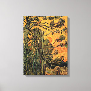 Lienzo Árboles de pino contra un cielo rojo y poner sol