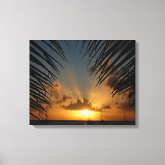Lienzo Atardecer a través de la orilla de la palma