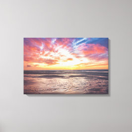 Lienzo Atardecer sobre la playa y el mar