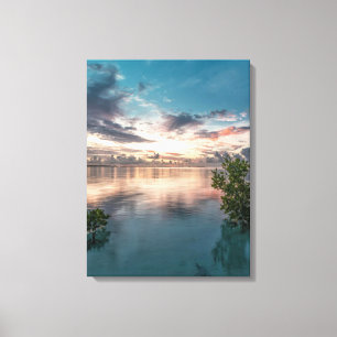 Lienzo blue sky with red and dark clouds reflected on sea