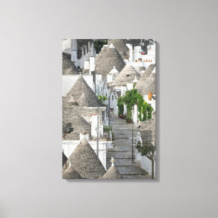 Lienzo Calle con casas trulli en Alberobello, Puglia