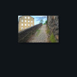 Lienzo Dean Clough Cobblestone Climb - Brandt's Spirit<br><div class="desc">Ascend a charming, overgrown cobblestone path in Dean Clough, Halifax, where historic industrial architecture meets the subtle vibrancy of nature. This image, while inspired by the evocative work of Bill Brandt, brings a fresh perspective with its natural colors, highlighting the subtle greens of the moss and the warm tones of...</div>