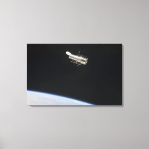Lienzo El telescopio espacial de Hubble en órbita sobre