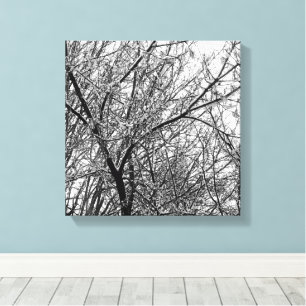 Lienzo Foto artística de BW sobre la nieve en ramas de ár