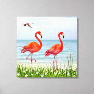 Lienzo Hermosos flamencos rojos cerca de flores blancas