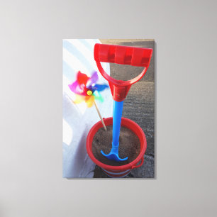 Lienzo Juguetes brillantemente coloreados de la playa