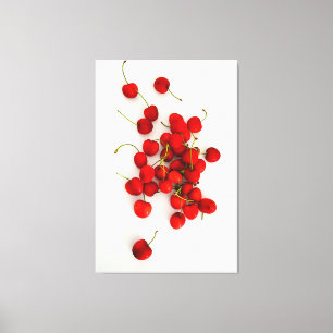 Lienzo Las cerezas rojas con luz natural yacen en blanco