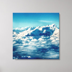 Lienzo Las montañas Himalayas en las nubes cielo azul